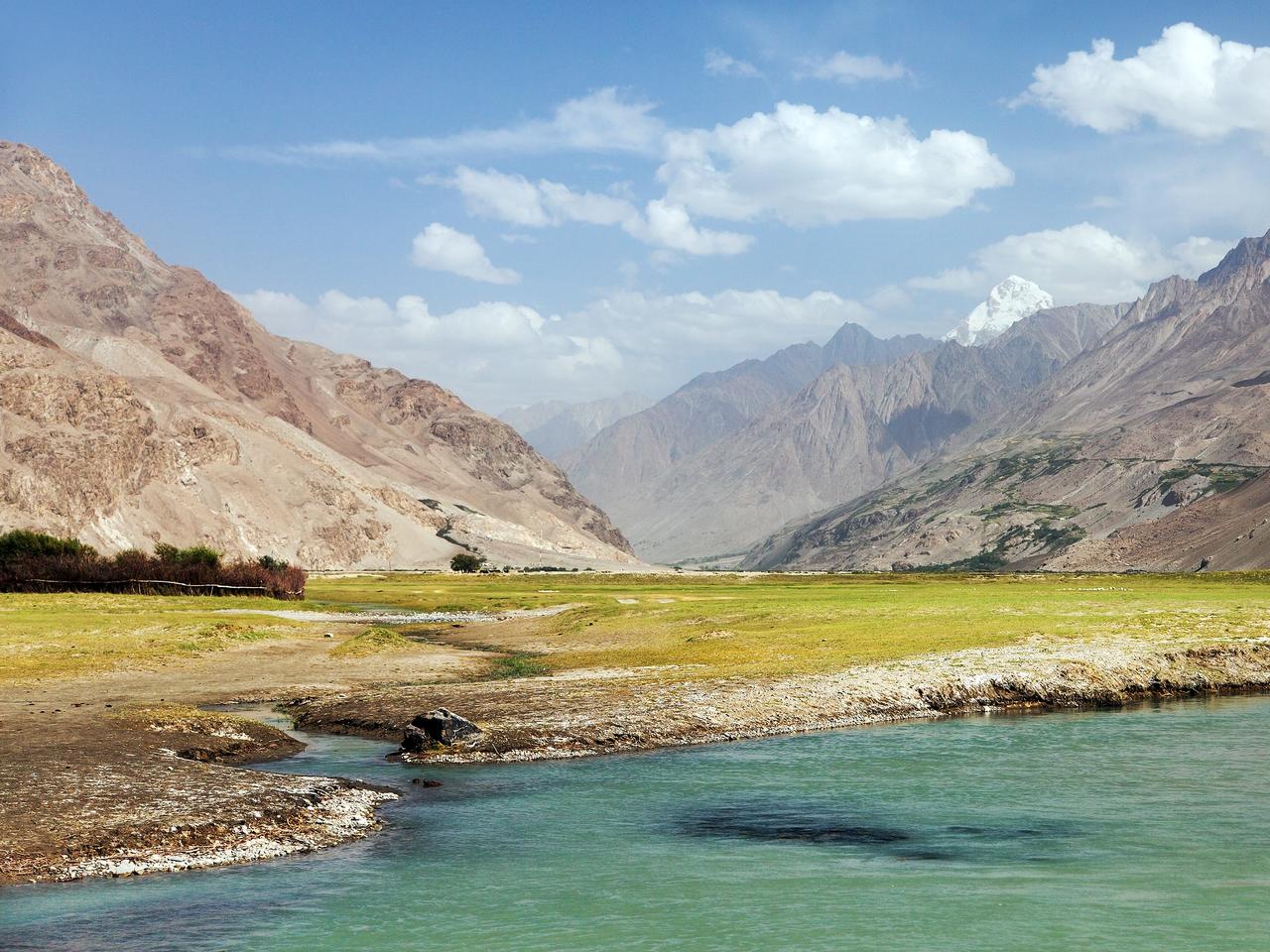 Panj river, Pamir and Hindukush mountains. Panj is upper part of Amu Darya river. Panoramic view. Tajikistan and Afghanistan border. Pamir highway, Wakhan valley