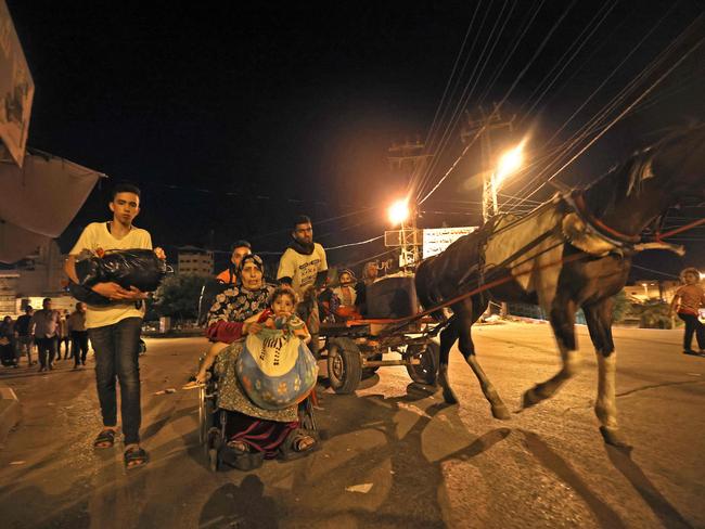 Palestinian families have been forced to evacuate their homes due to heavy shelling by the Israeli military. Picture: Mohammed Abed / AFP