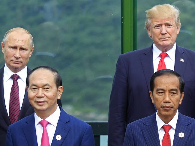 The two leaders pictured with Vietnamese President Tran Dai Quang and Indonesian President Joko Widodo during the Asia-Pacific Economic Cooperation (APEC) Summit. Picture: Hau Dinh/AP
