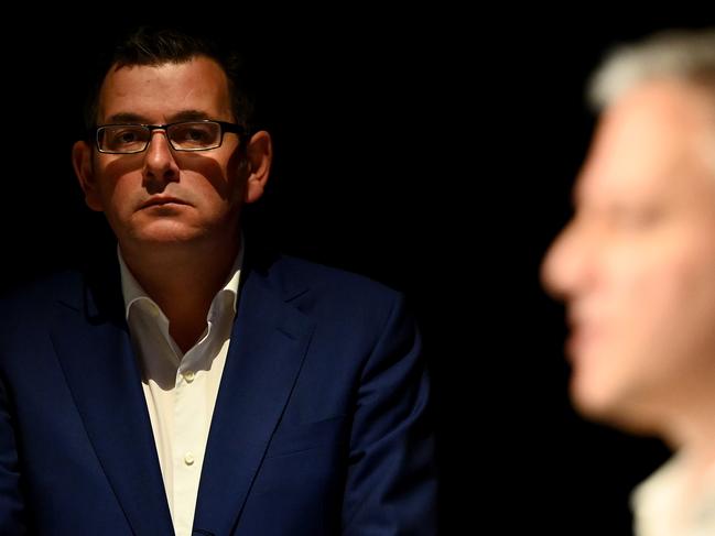 MELBOURNE, AUSTRALIA - MAY 11: Victorian premier Daniel Andrews looks on as Victorias Chief Health Officer Professor Brett Sutton speaks to the media on May 11, 2020 in Melbourne, Australia. Premier Daniel Andrews has announced some easing of COVID-19 restrictions for Victorians in response to Australia's declining coronavirus (COVID-19) infection rate. From 11:59pm on Tuesday 12 May, people in Victoria will be allowed to visit friends and family. A maximum gathering of up to ten outdoors is allowed, or up to five visitors inside a home. (Photo by Quinn Rooney/Getty Images)