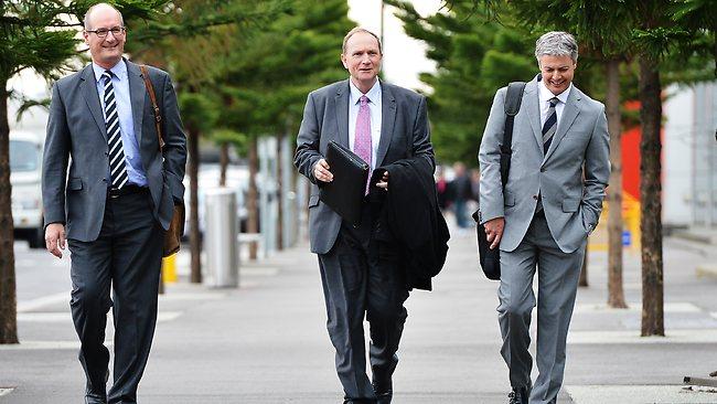 St Kilda president Peter Summers, centre, on his way to a meeting at AFL House with Port Adelaide chairman David Koch and Hawthorn boss Andrew Newbold. Picture: Tim Carrafa