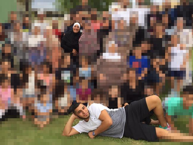 In this group photo he cheekily lays across the front of shot, while his mum Maha Hamze – who was shot in 2013 but has never been involved in any crime – smiles happily among her relatives. Picture: Facebook