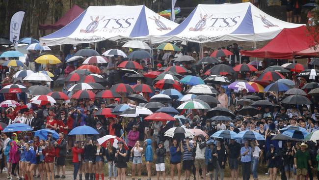 Pouring rain couldn’t dampen the enthusiasm of supporters or crews at last year’s Head of the River. Picture: Josh Woning/AAP