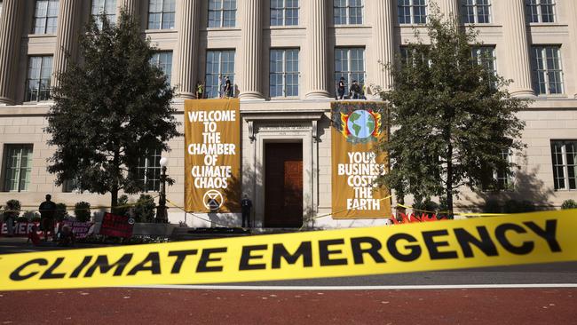 Climate activists protest from the side of the US Chamber of Commerce in Washington. Picture: AFP