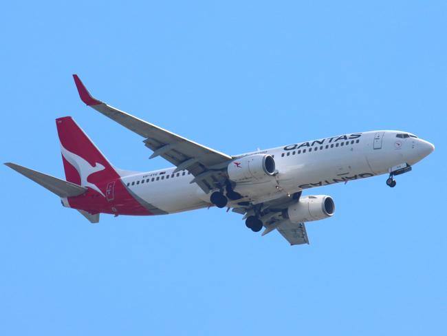 Planes arriving and leaving Brisbane Airport. QANTAS flight on approach to the airport. Eagle Farm 29th August 2021 Picture David Clark