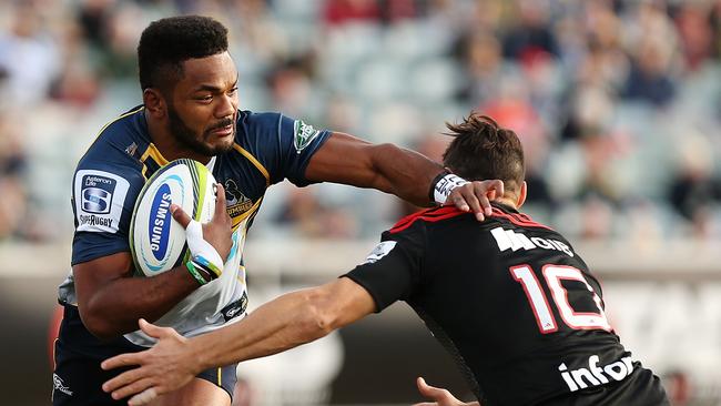 Henry Speight of the Brumbies is tackled by the Crusaders at GIO Stadium.