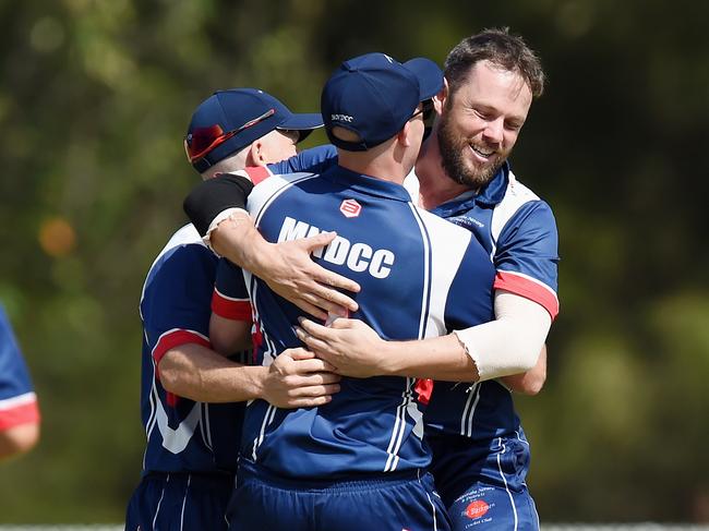 Mudgeeraba Nerang celebrate the wicket of Southport Labrador’s Mike Alexander in Sunday’s T20 final. Picture: Lawrence Pinder