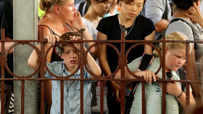 Tired commuters left stranded during the early rail chaos. Picture: Jonathan Ng