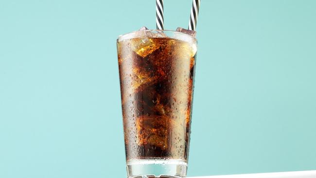 A single can of cola can contain nine cubes of sugar. Picture: Getty Images