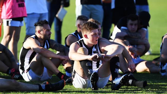 Dejected Reynella players after last season’s grand final loss to Flagstaff Hill. Picture: AAP/Mark Brake