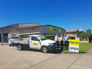 DRIVING A DEAL: Ray White Commercial Caloundra agents Len Greedy and Alan Gray with Hertz branch location manager Kim Steenbergen. Picture: Contributed