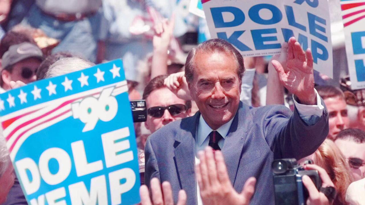 Republican presidential candidate Bob Dole waves to supporters in 1996.