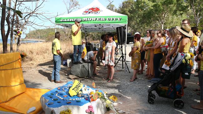 A large, permanent concrete memorial for Toyah Cordingley has been unveiled in a service at Wangetti Beach. Sculptor Cameron Donnachie and family friend Wayne "Prong" Trimble speak to the crowd gathered before unveiling the memorial stone. PICTURE: BRENDAN RADKE