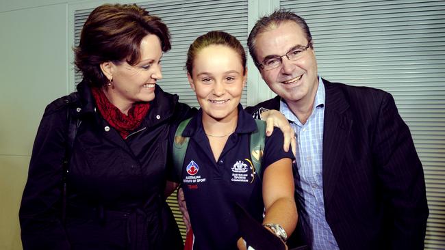 Barty with her parents after winning the junior Wimbledon title in 2011.