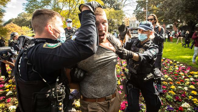 A protester is arrested during the Sydney Freedom Rally in July. Picture: Julian Andrews