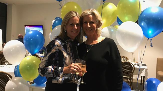 Angie Bell celebrates her victory in the seat of Moncrieff with her partner Ros Franklin.