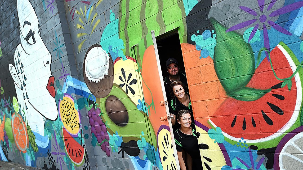 (bottom) Amanda, Fiona and Billy McCracken from Beemart in Maryborough with a mural.