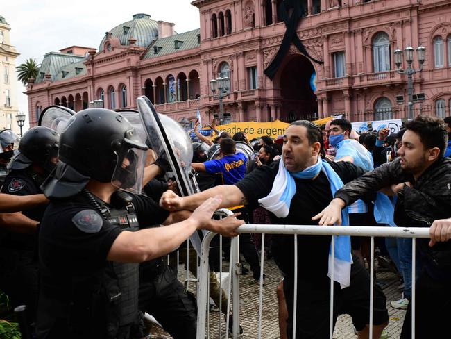 Fans clash with police.