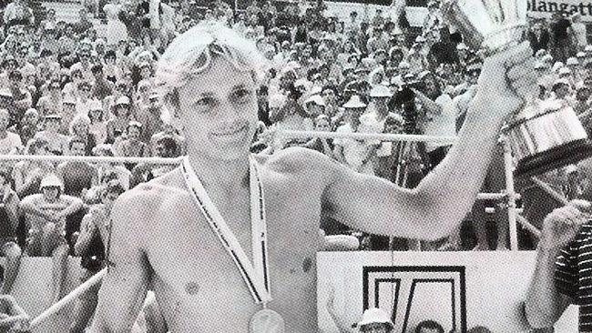 1984 Coolangatta Gold winner Guy Leech with his medal and trophy at Coolangatta beach.