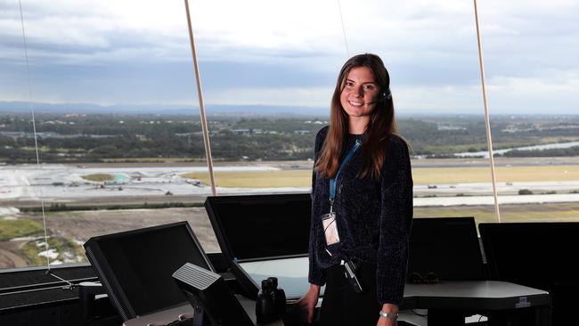 Air traffic controller Laura Willard overlooking the new runway in the air traffic control tower at Brisbane Airport. Picture: Tara Croser