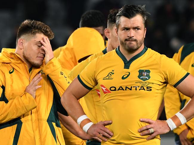 Wallabies players James O'Connor (left) and Adam Ashleigh-Cooper react  following the Bledisloe Cup match between the New Zealand All Blacks and the Australian Wallabies  at Eden Park in Auckland, New Zealand, Saturday, August 17, 2019. (AAP Image/Dave Hunt) NO ARCHIVING, EDITORIAL USE ONLY