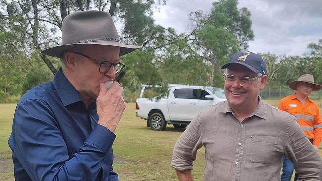 Prime Minister Anthony Albanese and Senator Murray Watt try locally grown lychees. Photo: Kentos Komms