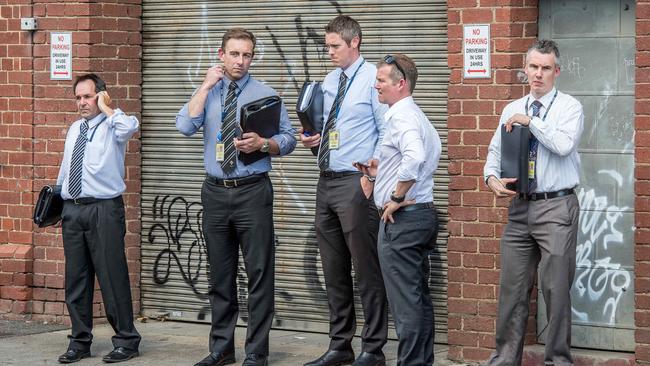 Detectives continue their investigations at the scene of Mr Acquaro’s murder. Picture: Jake Nowakowski