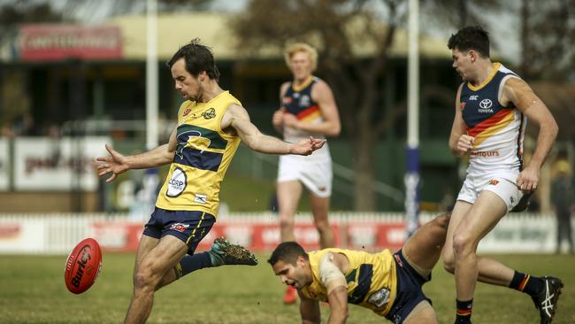 Mitch McGovern, right, bumps former Crow Jared Petrenko in the SANFL earlier this month. Picture: AAP/MIKE BURTON