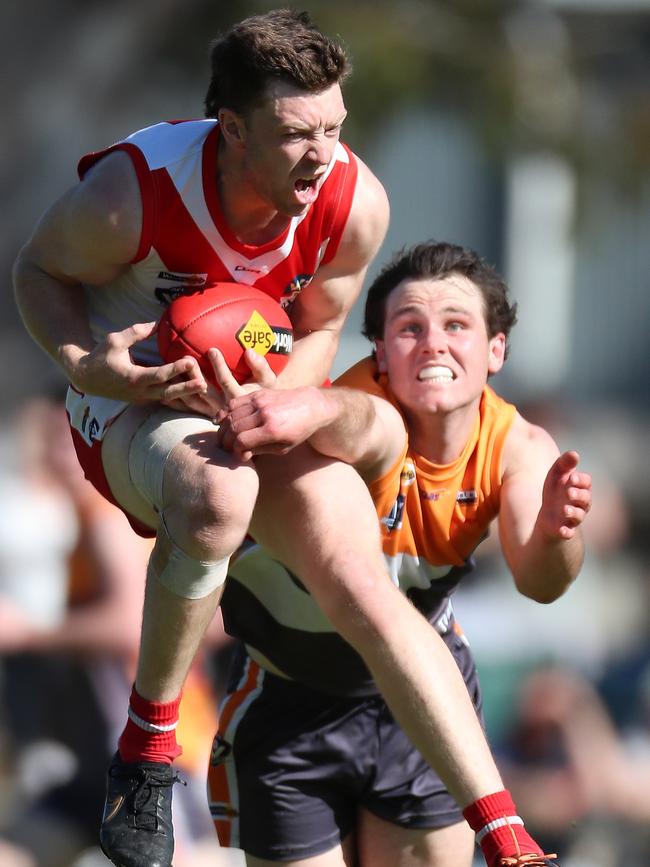 Ararat’s Tom Mills marks on the lead.