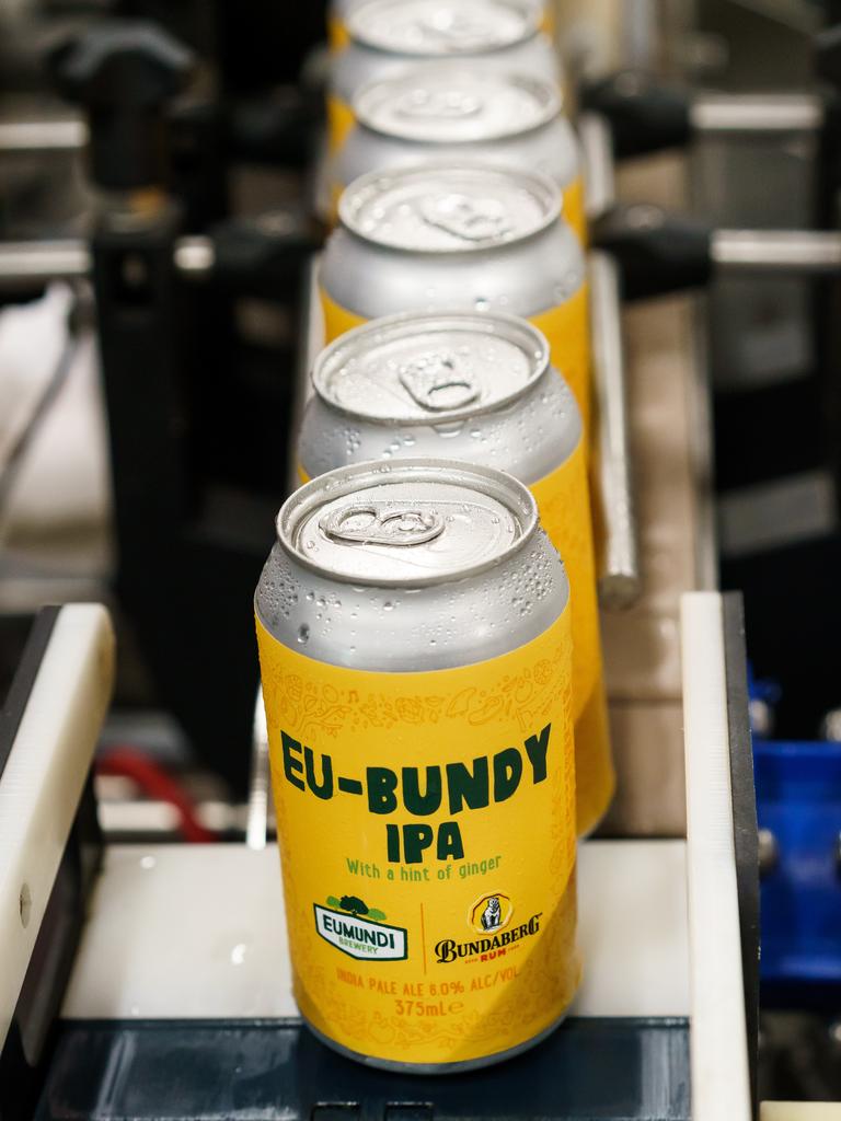 Eu-bundy IPA cans emerging from the canning line at Eumundi Brewery. Picture: Alain Bouvier.