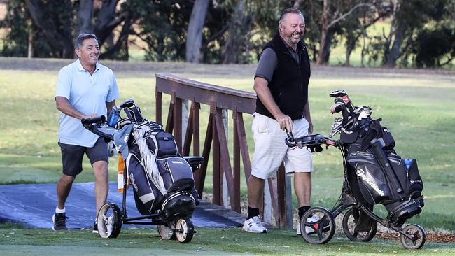 Mark McPherson and Brenton walk the course. Picture: Sarah Reed