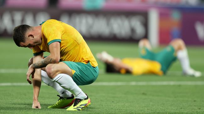 DOHA, QATAR - APRIL 18: Jordan Courtney-Perkins of Australia reacts after losing against Indonesia during the AFC U23 Asian Cup Group A match between Indonesia and Australia at Abdullah Bin Khalifa Stadium on April 18, 2024 in Doha, Qatar.(Photo by Mohamed Farag/Getty Images)