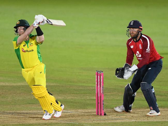 SOUTHAMPTON, ENGLAND - SEPTEMBER 08: Steve Smith of Australia plays a shot(L) as Jonny Bairstow of England(R) looks on during the 3rd Vitality International Twenty20 match between England and Australia at The Ageas Bowl on September 08, 2020 in Southampton, England. (Photo by Stu Forster/Getty Images for ECB)