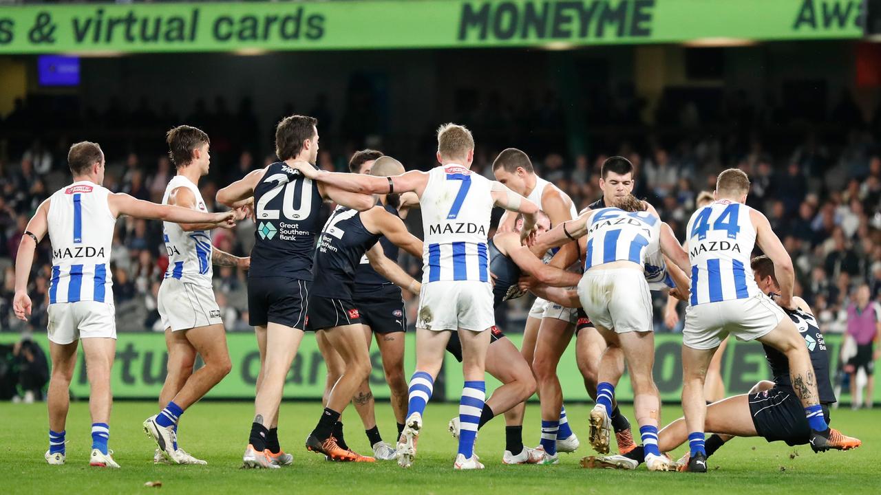 Nick Larkey of the Kangaroos and Lewis Young of the Blues clash. Photo by Michael Willson/AFL Photos via Getty Images.