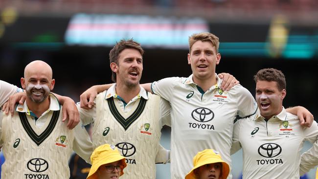 Nathan Lyon, Mitch Marsh, Cameron Green and Alex Carey of Australia of Australia sing the national anthem at Adelaide Oval. Picture: Paul Kane/Getty Images.