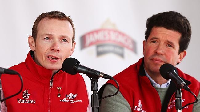 Dunaden jockey Jamie Spencer (left) and Dunaden trainer Mikel Delzangles speak during the 2013 Melbourne Cup parade at Federatio