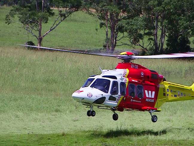 Coffs Harbour 23-12-17The Westpac Lifesaver Rescue Helicopter has airlifted a 23 year old male Trail Bike rider who is believed to have been impaled in the chest by a large piece of tree log. It’s understood he was riding with friends and crashed just after attempting a jump along a fire trail off Gum Flat Road, near  Sherwood Road, 10km North of Coffs Harbour at about 9.30am this morning.Ambulance and Police responded to the scene and gingerly transported the man to a helicopter landing site 1.5km from the crash scene, where he was further stabilized and loaded into the helicopter, bound for Gold Coast University Hospital.Ambulance NSW Duty Operations Manager, Inspector Dean Lassau said at the scene “a 23 year old male suffered a penetrating wound to his right chest, he’s being transport to the Gold Coast Hospital in a serious but stable condition, it looks like he had a piece of wood that is embedded into the right side of his chest and it was very painful”Inspector Lassau made a plea for trail bike riders to wear all appropriate safety clothing and helmets when engaging in these kinds of activities.Photo Frank Redward