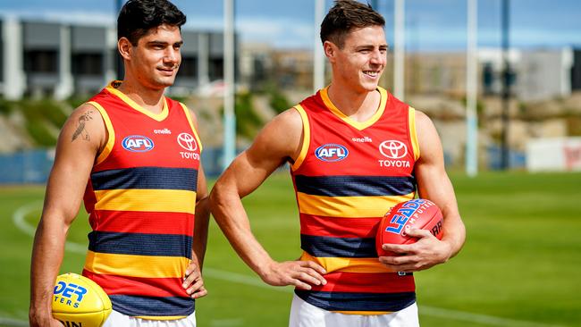 Crows players Shane McAdam and Jake Kelly wearing the club’s new 2021 red away jumper. Kelly has told the Crows he wants to return to Victoria. Picture: Mike Burton