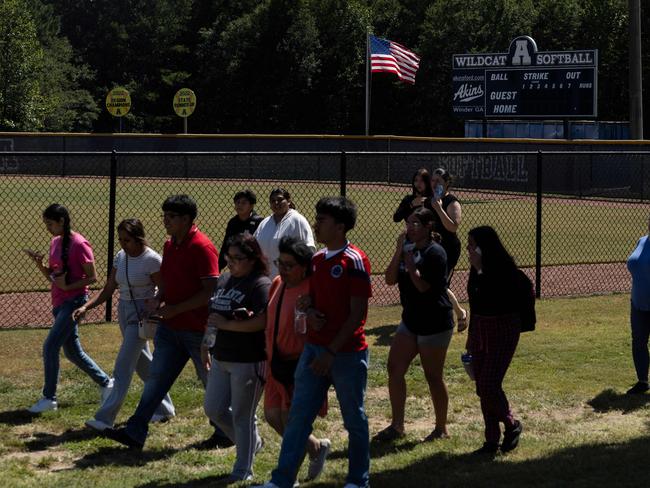 Students leave the scene of another school shooting. Picture: AFP