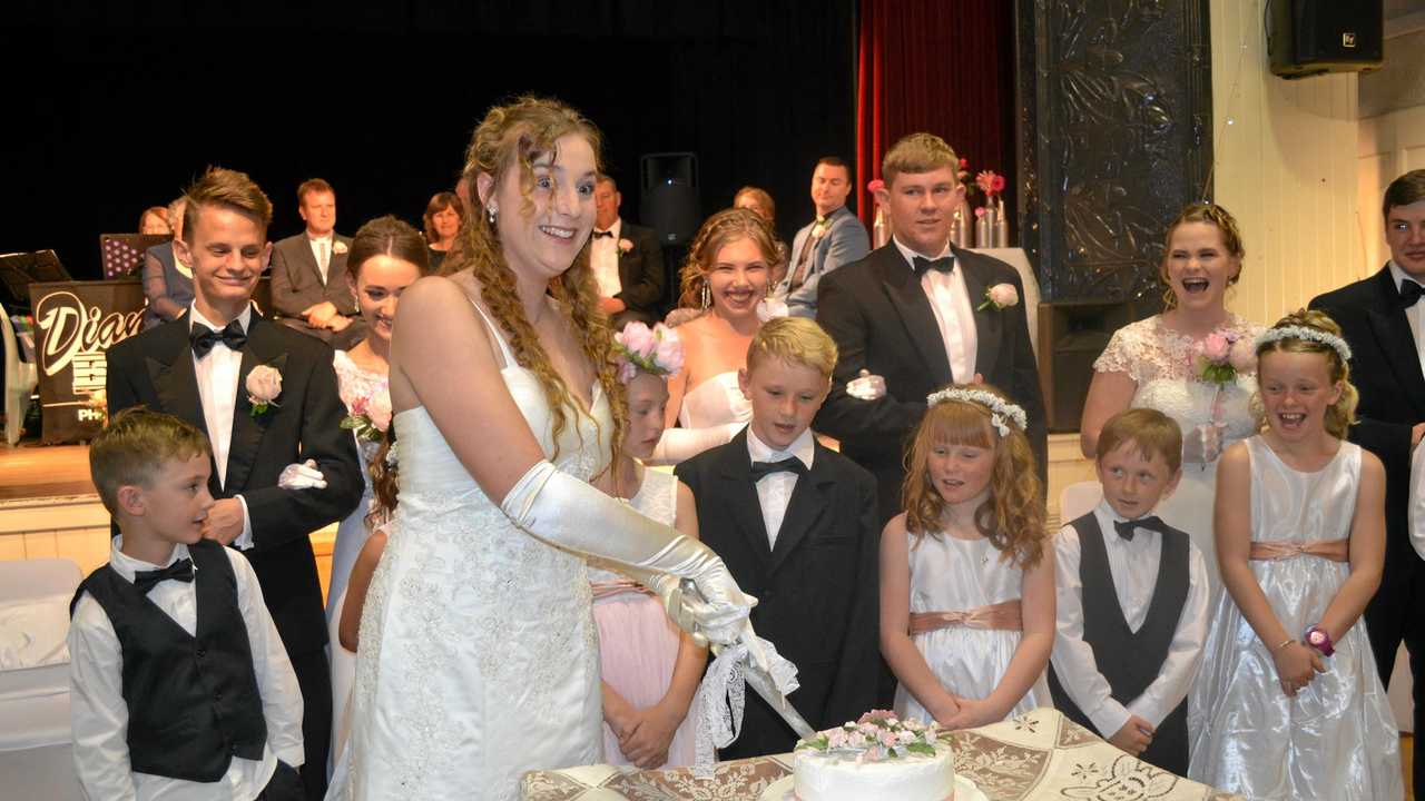 Calista Hanna officially cuts the debutante cake. Picture: Molly Hancock