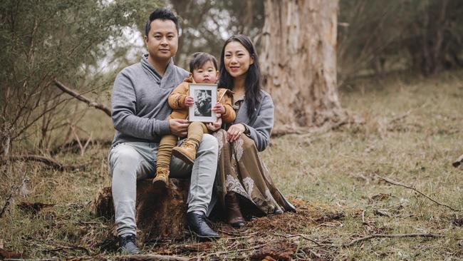 Adrian and Lina Wong with son Jaxon and a photo of their stillborn baby Mason. Picture: Adrienne Myszka.