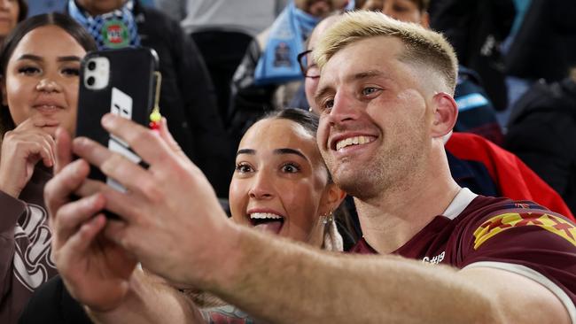 Cameron Munster takes a selfie with fans after starring for the Maroons in Game I. Picture: Mark Kolbe/Getty Images