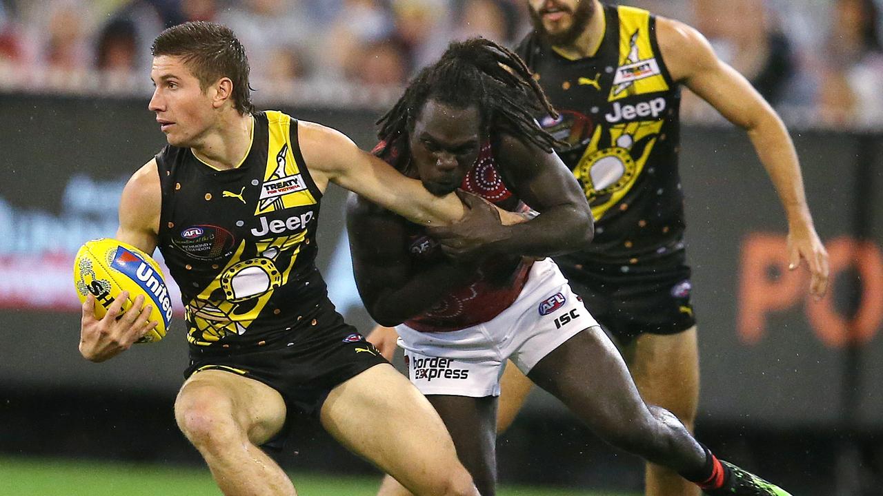 Liam Baker is chased by Anthony McDonald-Tipungwuti on Saturday night.