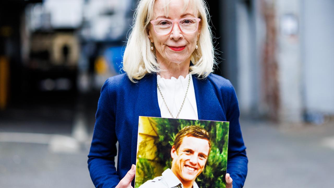 Katrina Korver holding a photo of her son Danial in Rainbow Alley. where he died last June. Picture: NCA NewsWire / Aaron Francis