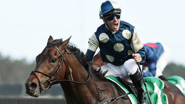 Tommy Berry shows his delight as Gringotts brings up another feature win in The Gong at Kembla Grange. Picture: Jeremy Ng/Getty Images