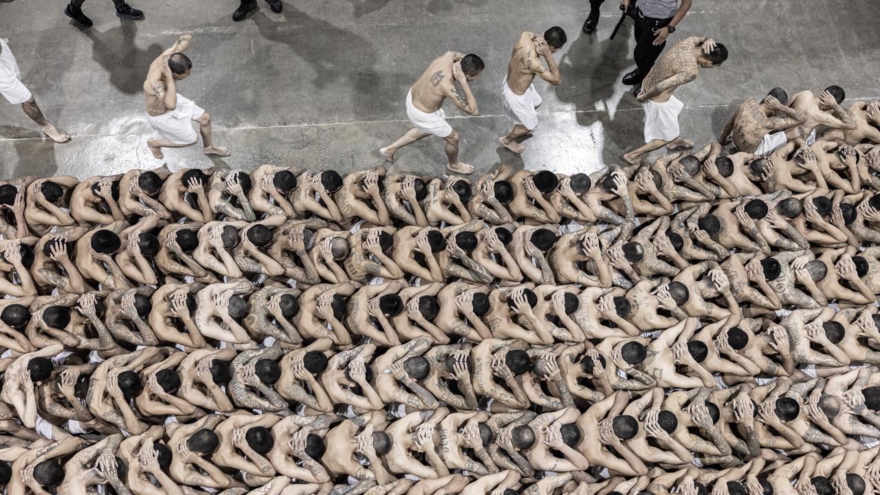 Inmates wait as 2000 detainees are moved to megaprison CECOT on June 11, 2024 in Tecoluca, El Salvador. Picture: Getty Images