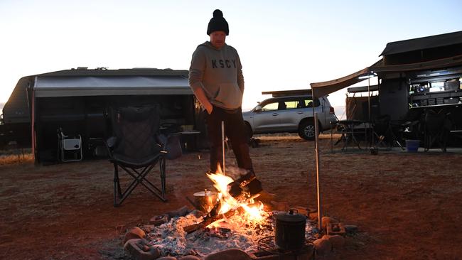 Early morning camper Simon Hawkey prepares for the first day of Finke Desert Race 2022. Picture: (A)manda Parkinson
