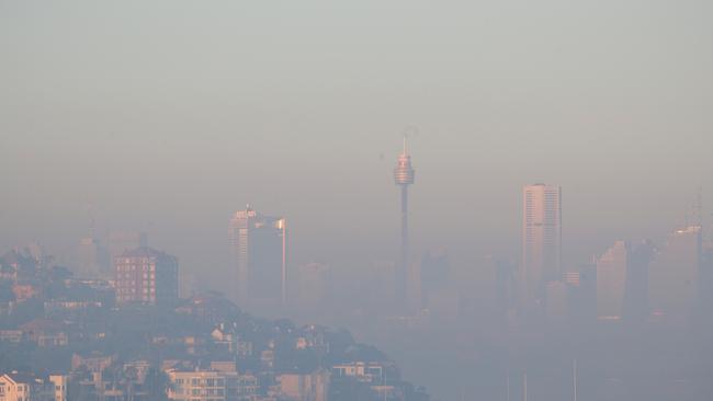 Smoke blowing in from the north has settled on Sydney, causing health issues for many with breathing problems. Picture: John Grainger