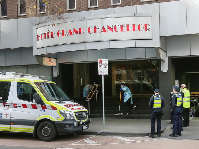 MELBOURNE, AUSTRALIA - NewsWire Photos AUGUST 11, 2020 : Melbourne is in a stage 4 lockdown with the state of Victoria in a stage 3 lockdown as COVID-19 spreads in a second wave. Hotel Grand Chancellor in Lonsdale St. Melbourne is being used as a quarantine hotel. Paramedics arrive and a young woman who walked out was taken away.Picture : NCA NewsWire / Ian Currie