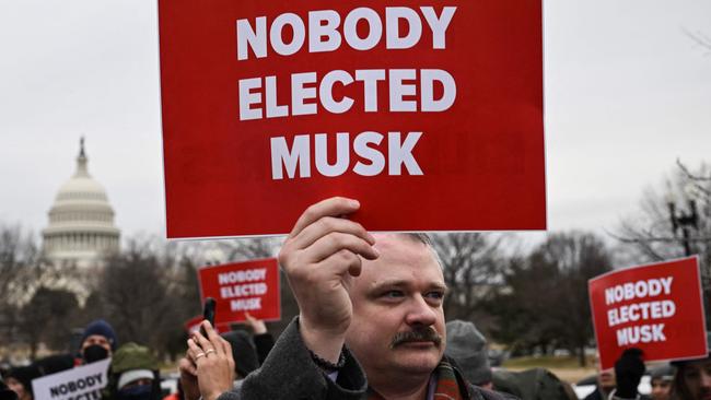 People protest against and Elon Musk's "Department of Government Efficiency" (DOGE) outside the US Department of Labor in Washington. Picture: AFP.